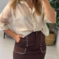 FALDA TACHUELAS MARRON